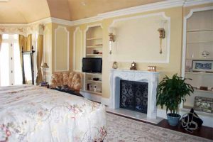 Beautiful Master Bedroom with fireplace and flat-panel TV installed