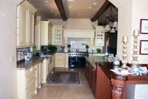 Beautiful Chef's Kitchen with ceiling speakers installed and Touchpanel Control in Audio, Video, and Control System