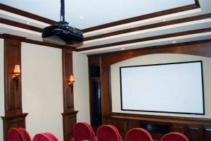 Home Theater with movie screen, projector, surround system and Touchpanel control in Audio, Video, and Control System