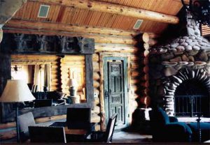 Log Home Living Room with ceiling speakers installed and whole-house A/V control