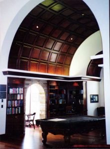 Living Room with speakers in high-vaulted ceiling and Touchpanel control for Audio, Video, and Control Systems