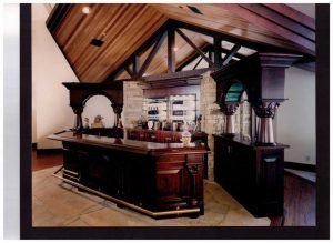 Bar with speakers in high vaulted ceiling and Touchpanel control for Audio, Video, and Control Systems