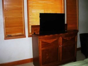 Aspen Home Guest Bedroom with ceiling speakers and pop-up television installed, Touchpanel control